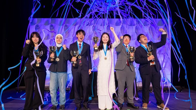 Group photo of the Pearson Certiport Microsoft Office Specialist World Championship winners: Liang Xinzhi (Macao, China), Reem El Shafii (Lebanon), Zhong Tin Kin (Macao, China), Nguyen Mai Chi (Vietnam), Sio Keng Nim (Macao, China), and Santiago Matteus Dardón Pinzón (Guatemala), recognized for Microsoft PowerPoint, Word, and Excel competitions.